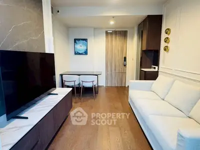 Modern living room with sleek furniture and stylish decor in a contemporary apartment.