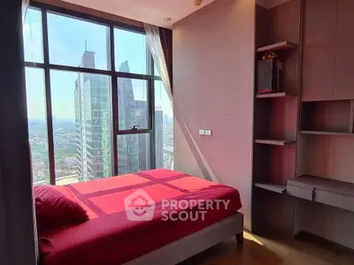 Modern bedroom with stunning city view and floor-to-ceiling windows