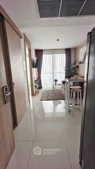 Modern apartment interior with open layout, featuring a cozy living area and stylish decor.