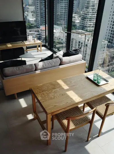 Modern living room with city view, sleek furniture, and floor-to-ceiling windows.