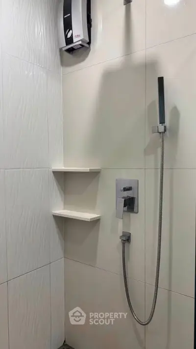 Modern bathroom shower with sleek fixtures and elegant tile design