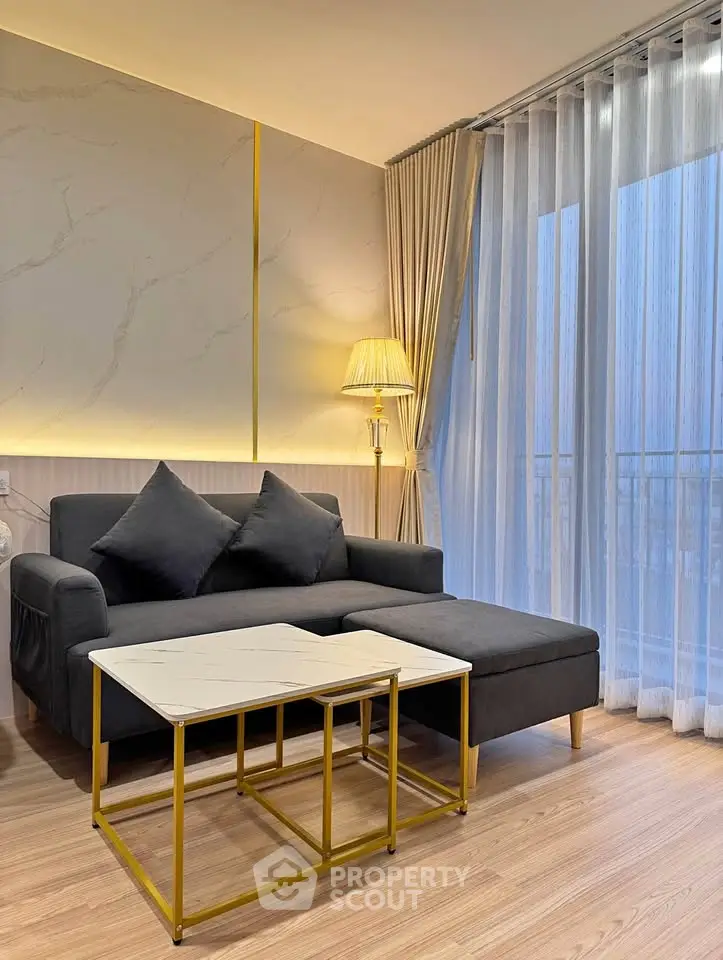 Stylish modern living room with elegant sofa and chic lighting, perfect for relaxation.