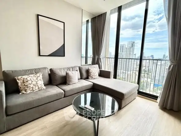 Stylish living room with floor-to-ceiling windows and city view