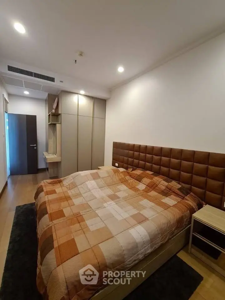 Cozy bedroom with modern decor and ample storage space