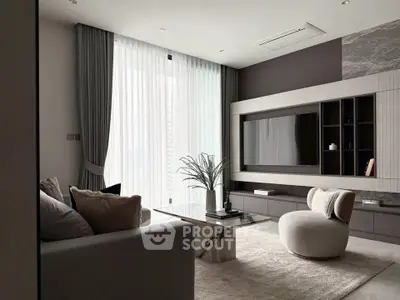 Modern living room with sleek furniture and large TV, featuring elegant curtains and a stylish coffee table.