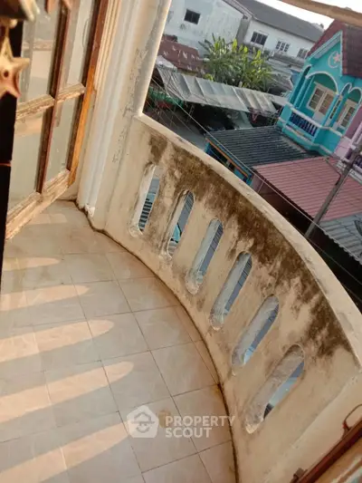 Charming small balcony with city view, perfect for morning coffee and relaxation.