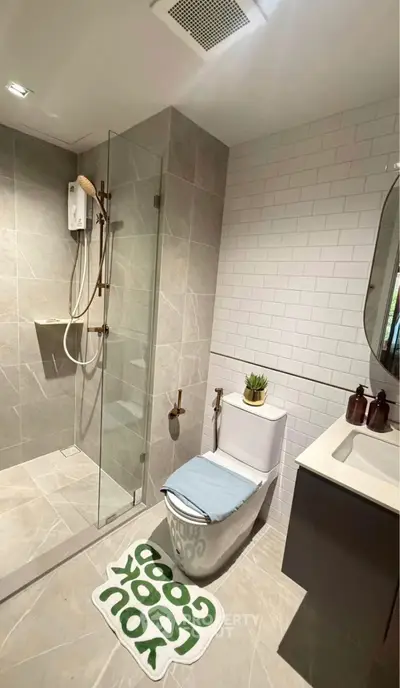 Modern bathroom with glass shower and stylish decor