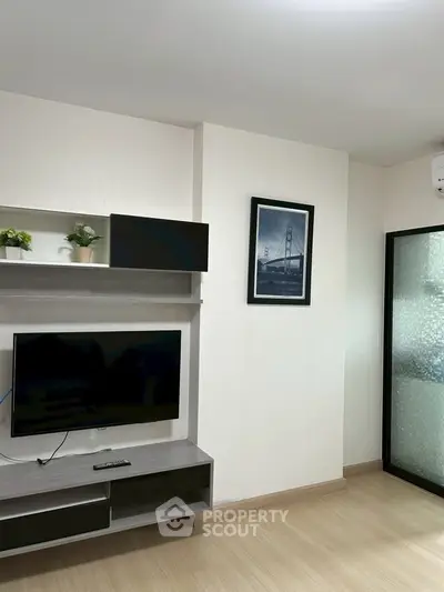 Modern living room with wall-mounted TV and stylish decor