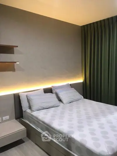 Modern bedroom with stylish lighting and cozy decor, perfect for relaxation.