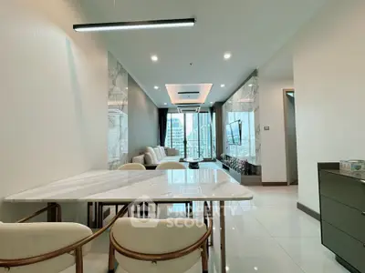 Luxurious modern living room with marble accents and city view, perfect for urban living.