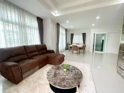 Spacious modern living room with elegant furniture and natural light