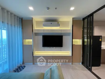 Modern living room with sleek TV setup and air conditioning in stylish apartment
