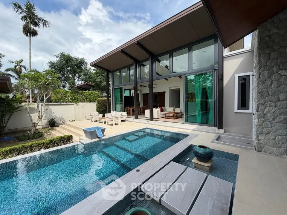 Luxurious modern villa with private pool and spacious outdoor area, perfect for relaxation and entertainment.