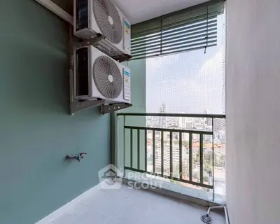Spacious balcony with city view and air conditioning units, perfect for relaxation.