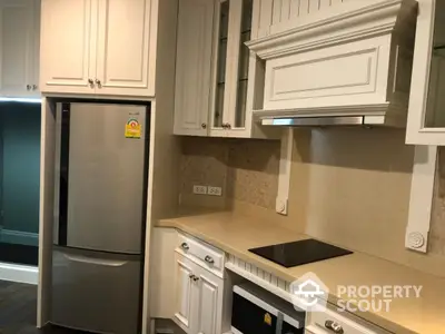 Modern kitchen with sleek appliances and elegant cabinetry