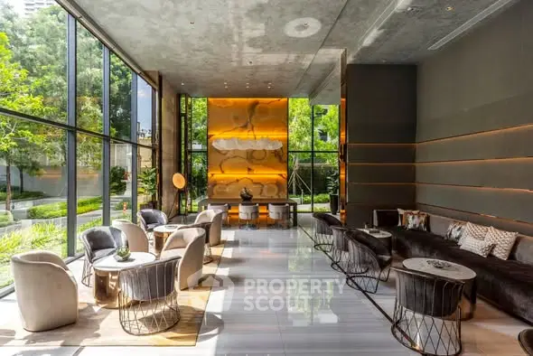 Luxurious modern lobby with floor-to-ceiling windows and elegant seating area.