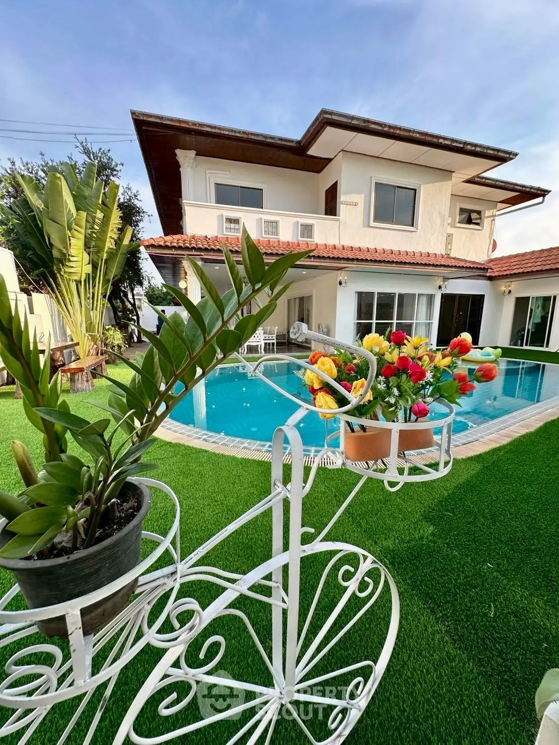Luxurious villa with private pool and lush garden, perfect for relaxation and entertaining.