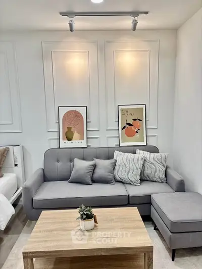 Stylish modern living room with elegant decor and cozy gray sofa