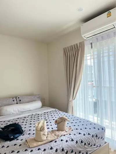 Cozy bedroom with modern air conditioning and natural light