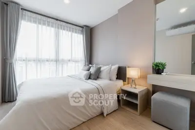 Modern bedroom with natural light, stylish decor, and cozy ambiance in a contemporary apartment.