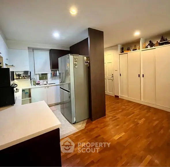 Spacious kitchen with modern appliances and ample storage space