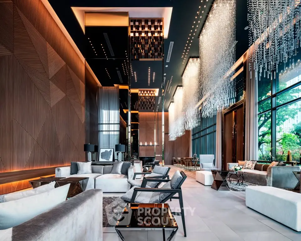 Luxurious modern living room with high ceilings and elegant lighting fixtures.