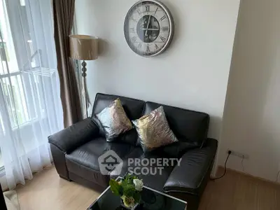 Stylish living room with leather sofa and chic decor