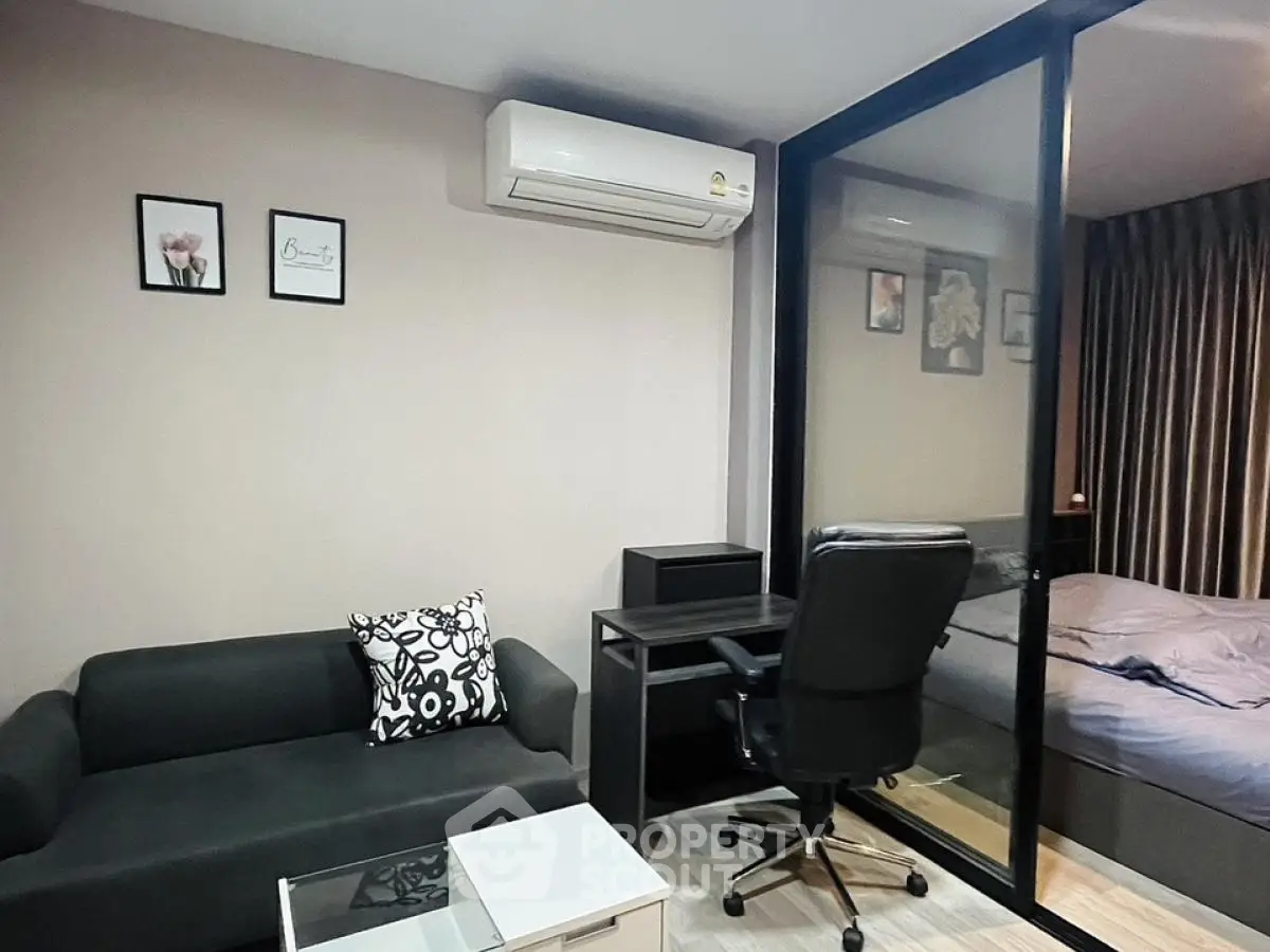 Modern studio apartment with cozy living area and stylish decor