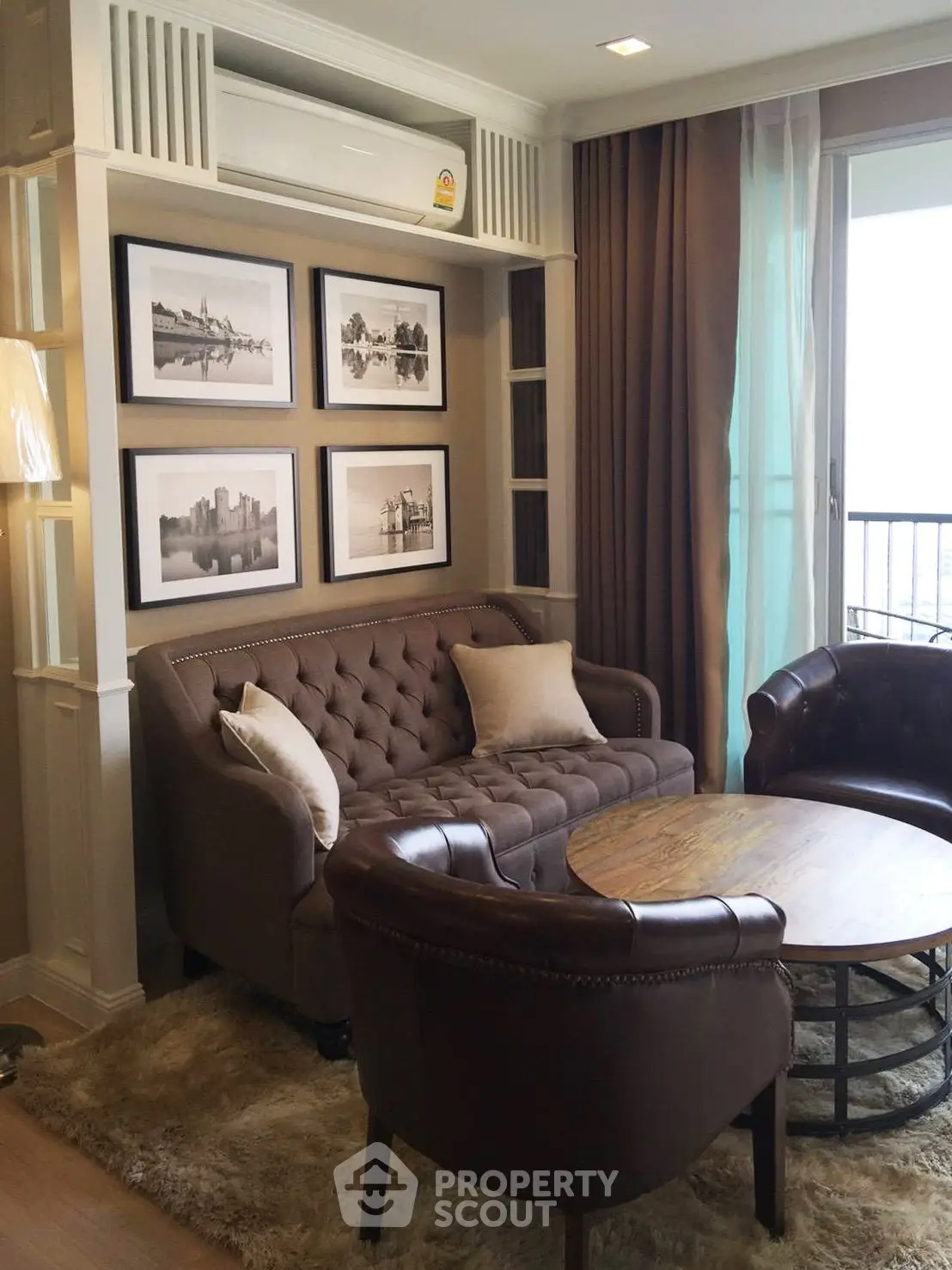 Chic living room with elegant leather furniture and framed art, perfect for stylish urban living.