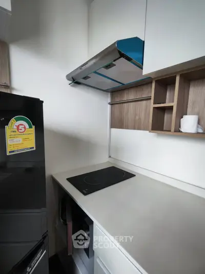 Modern kitchen with sleek induction cooktop and stylish cabinetry