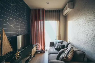 Stylish living room with modern decor, featuring a cozy sofa, TV, and elegant curtains.