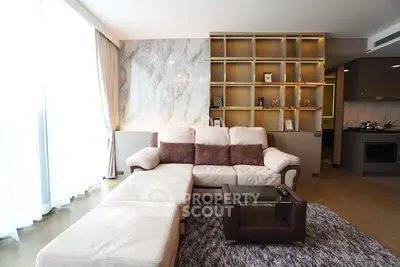 Luxurious modern living room with elegant marble wall and cozy sectional sofa