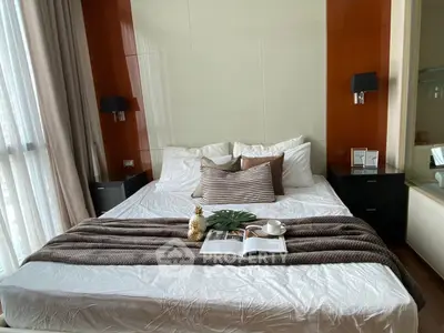 Luxurious bedroom with elegant decor and natural light, perfect for relaxation and comfort.