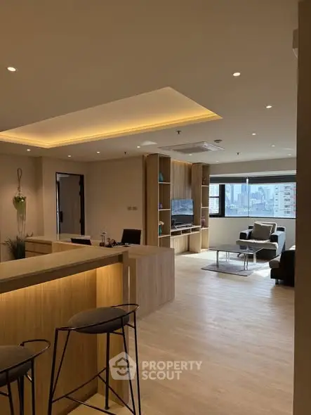 Spacious modern living room with city view and stylish wooden decor