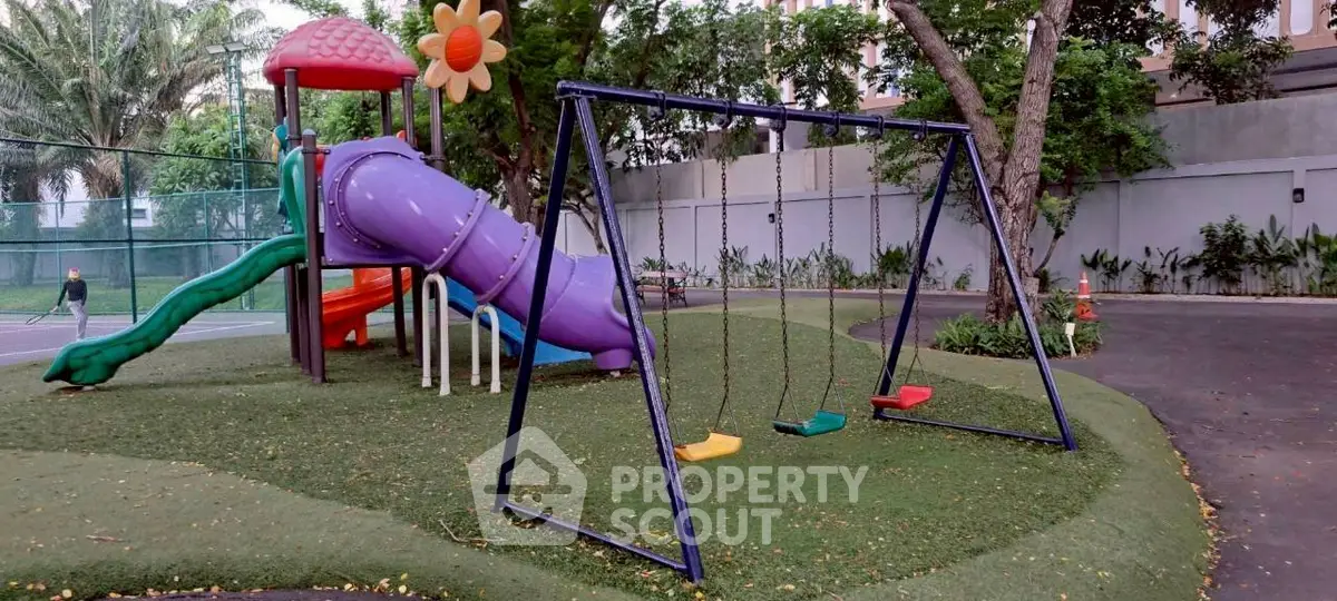 Charming playground area with slide and swings in a lush residential community.