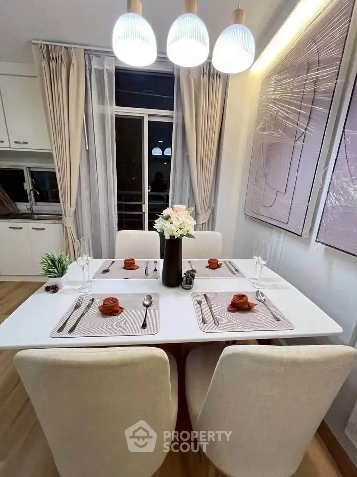 Elegant dining area with modern decor and ambient lighting in a stylish apartment.
