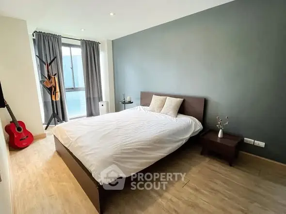 Modern bedroom with stylish decor and natural light