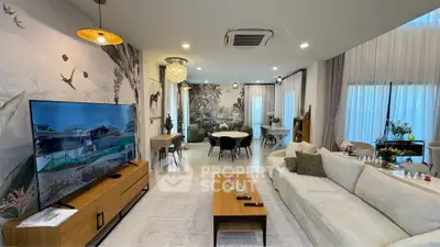 Luxurious living room with modern decor, spacious seating, and elegant lighting, perfect for relaxation and entertainment.