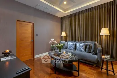 Elegant living room with cozy sofa, stylish decor, and warm lighting