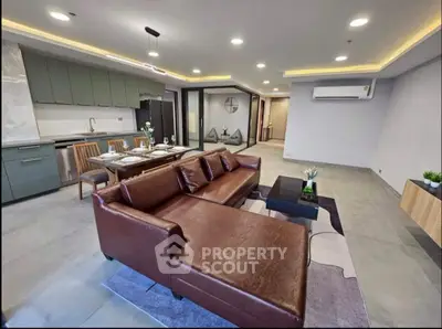 Spacious modern living room with open kitchen and stylish decor