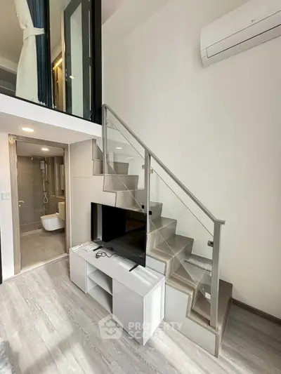 Modern loft apartment with sleek staircase and open layout