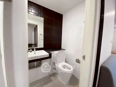 Modern bathroom with sleek design and contemporary fixtures in a stylish apartment.