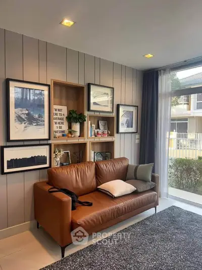 Stylish living room with leather sofa and modern decor, perfect for relaxation and entertaining.