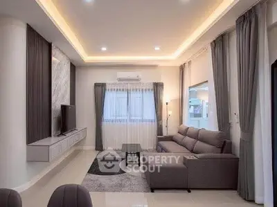 Modern living room with elegant lighting and stylish furniture, perfect for relaxation and entertainment.