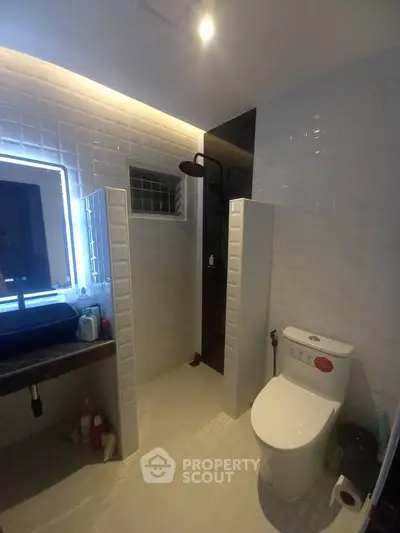 Modern bathroom with sleek shower and contemporary fixtures