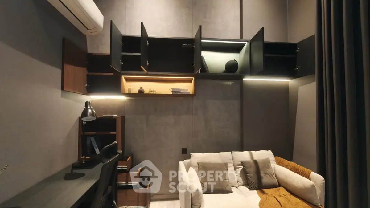 Modern living room with stylish open cabinets and cozy sofa in a contemporary apartment.