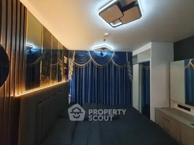 Luxurious bedroom with elegant blue drapes and modern lighting