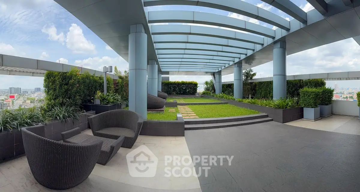 Stunning rooftop garden with panoramic city views and modern seating area.
