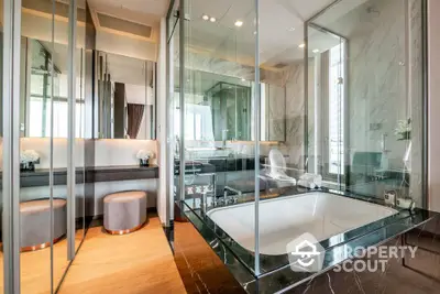 Luxurious modern bathroom with glass walls and elegant bathtub