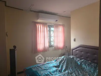 Cozy bedroom with air conditioning and soft lighting